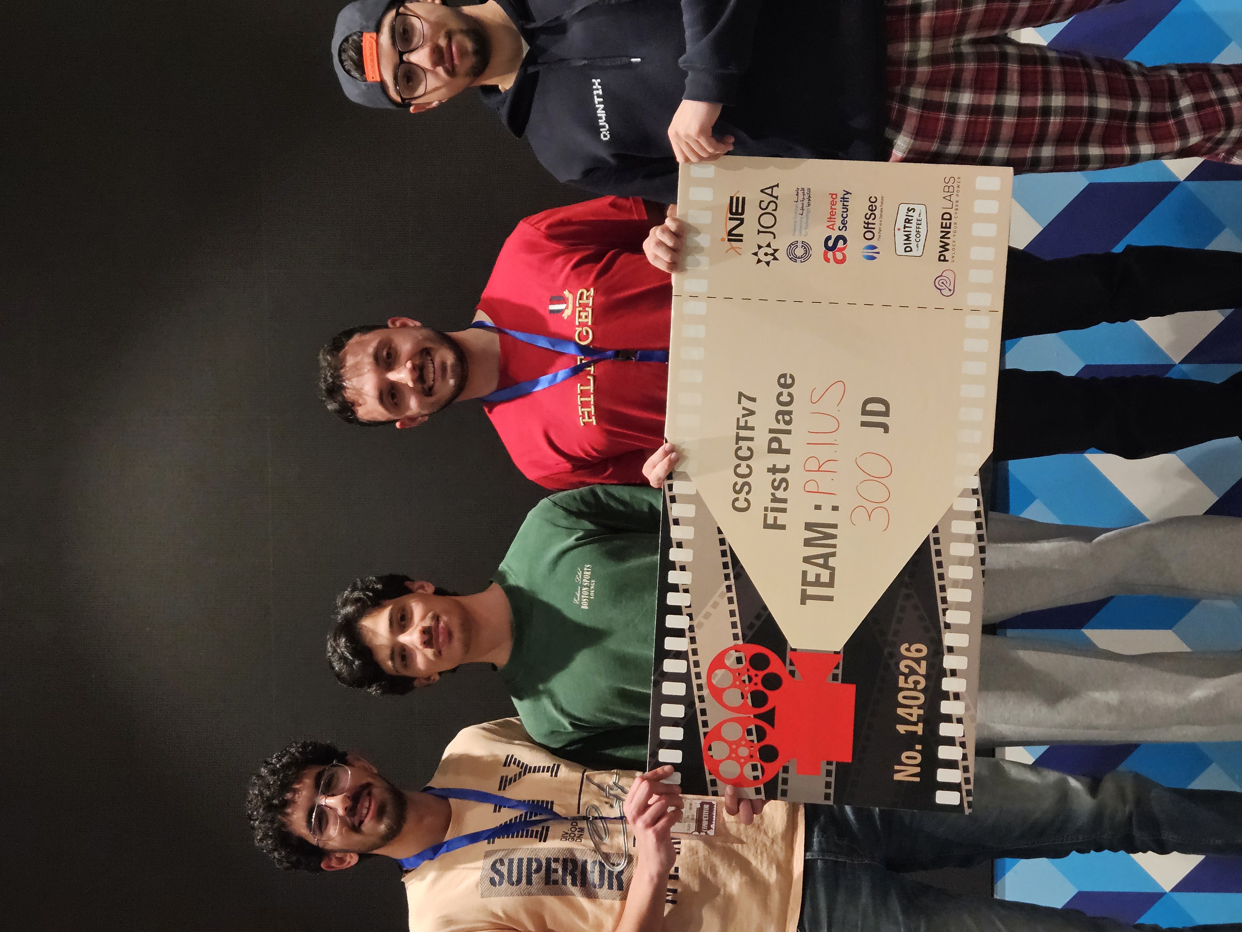 Winning team holding the ticket cheque